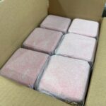Square tin boxes packed in protective bubble bags inside export carton