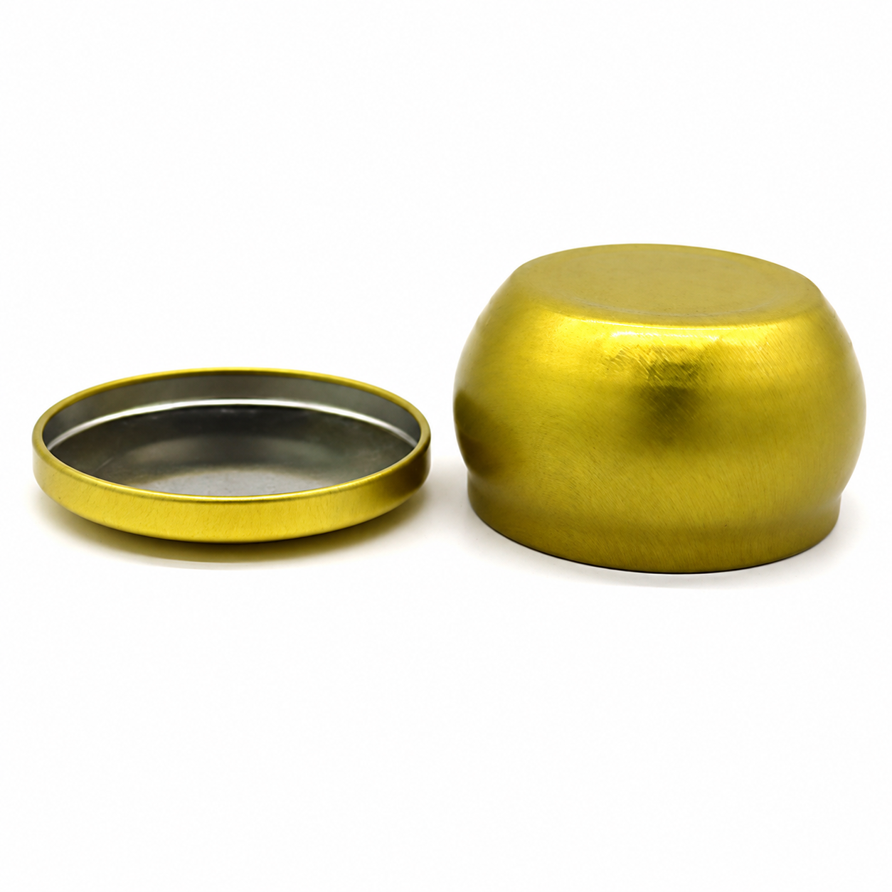 Bottom and removable lid view of a belly shaped candle tin