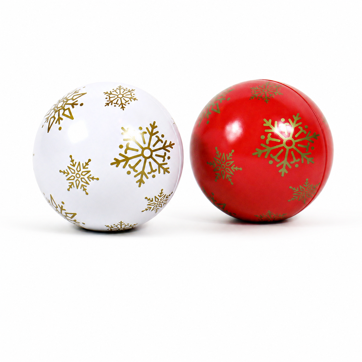 Christmas ball candy tins in red and white with gold snowflake patterns