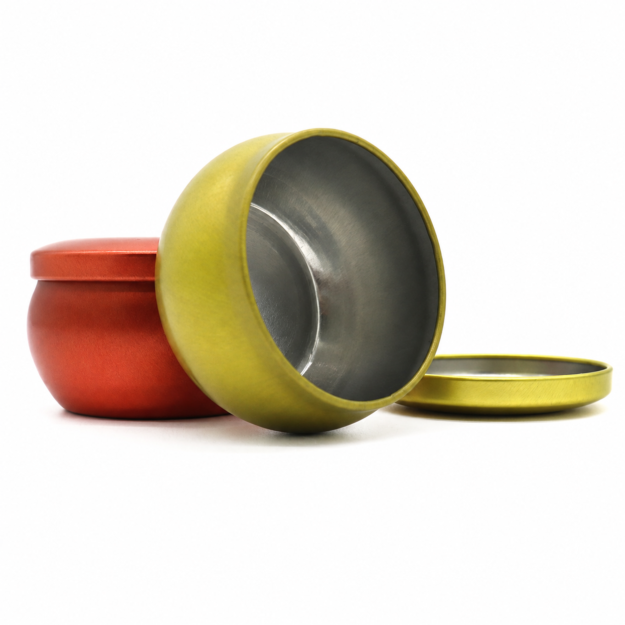 Open belly shaped candle tin showing the metal interior and removable lid