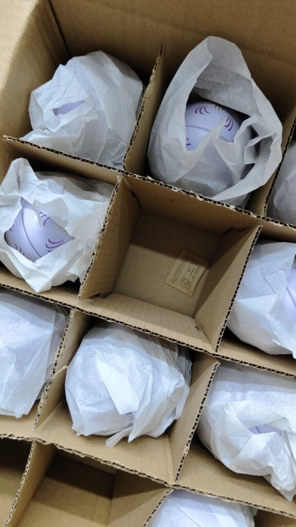 Tin boxes packed with carton dividers for transportation